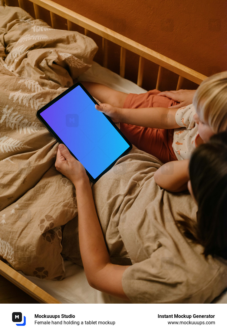 Female hand holding a tablet mockup
