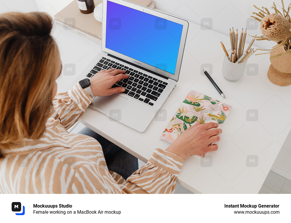 Female working on a MacBook Air mockup