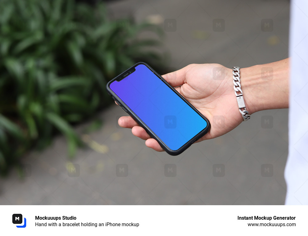 Hand with a bracelet holding an iPhone mockup