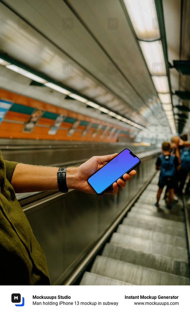 Man holding iPhone 13 mockup in subway