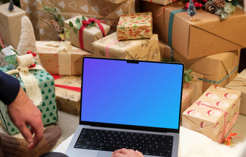 MacBook Pro 14 mockup surrounded by Christmas gifts