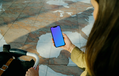 Woman holding iPhone 13 mockup at the airport