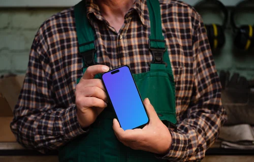 Crafter holding an iPhone 14 Pro mockup
