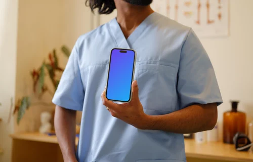 Doctor holding an iPhone mockup
