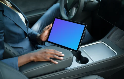 Entrepreneur holding an iPad Air mockup in Tesla