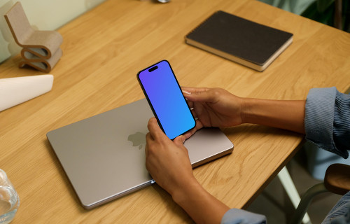 Hands holding an iPhone 14 Pro mockup