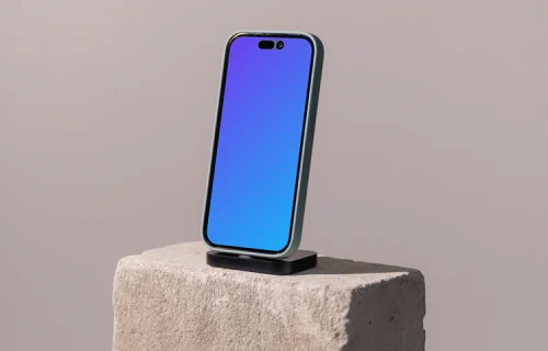 iPhone mockup on a concrete brick