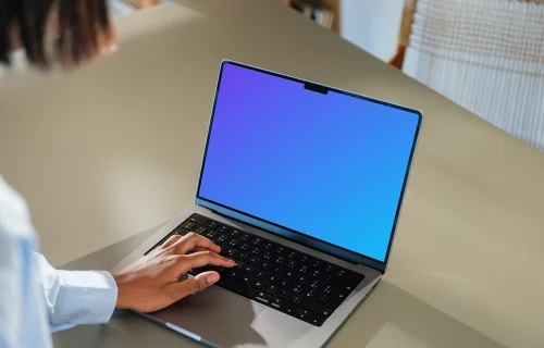 MacBook Pro 14-inch mockup at a modern desk