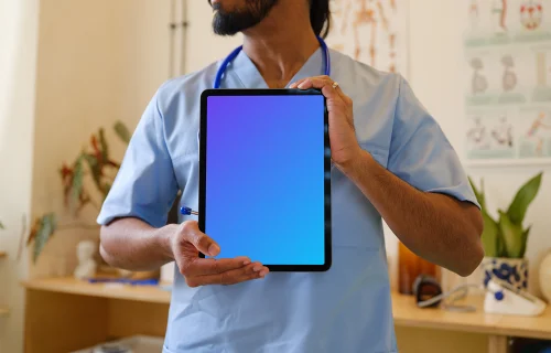 Male doctor holding an iPad mockup