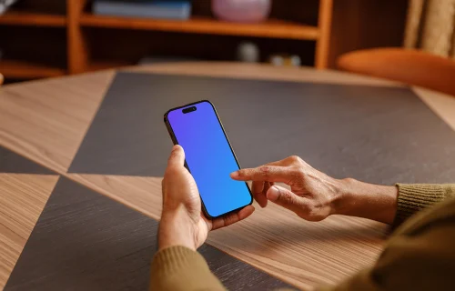 Male hand scrolling on the iPhone mockup