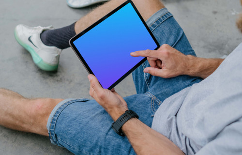 Male hand typing on an iPad Air mockup