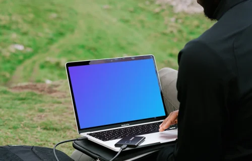 Man working on MacBook Pro mockup