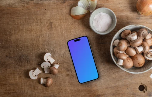 Mushrooms with a iPhone mockup on sideboard