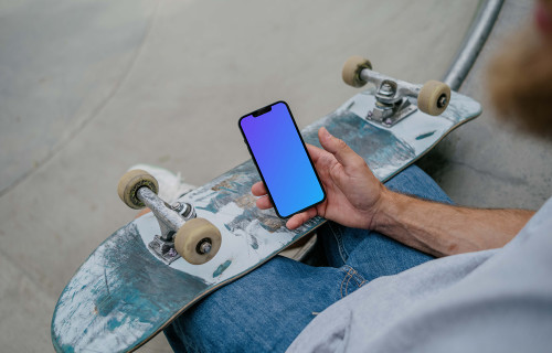 Skateboarder holding a smartphone mockup