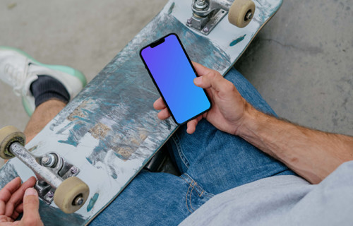 Skateboarder typing on an iPhone mockup