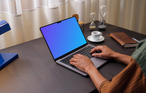 User typing on a MacBook Pro 14 mockup