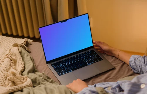 Woman holding a MacBook Pro 14 mockup