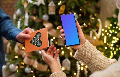 Woman holding a phone mockup while getting a gift card