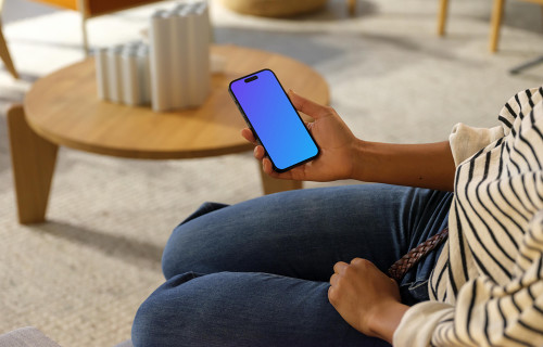 Woman holding an iPhone 14 Pro mockup