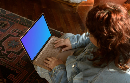 Woman typing on laptop mockup