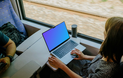 Woman working on a MacBook Pro mockup