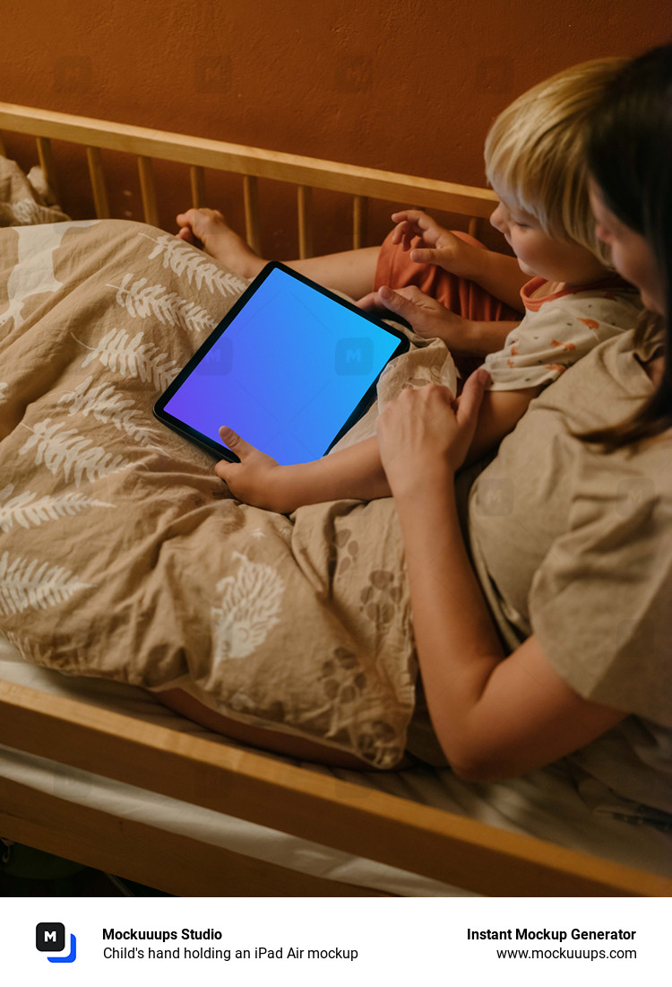 Child's hand holding an iPad Air mockup