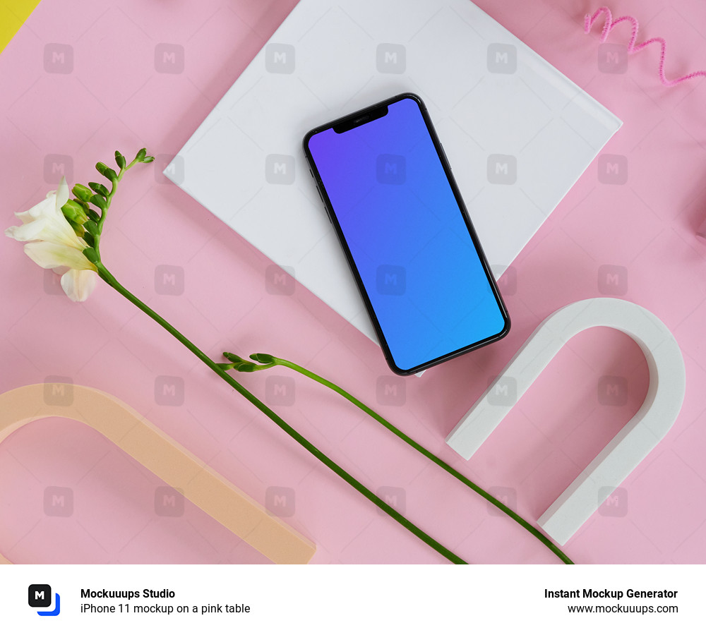 iPhone 11 mockup on a pink table