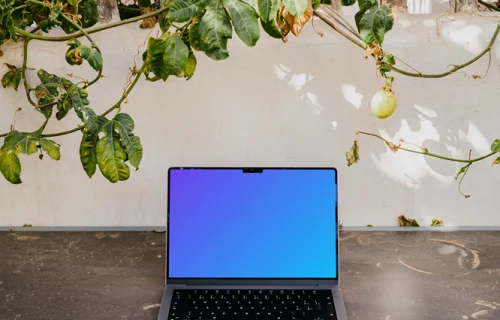 MacBook Pro mockup under a climbing plant