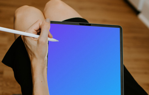 Tablet mockup with Apple pencil held by lady