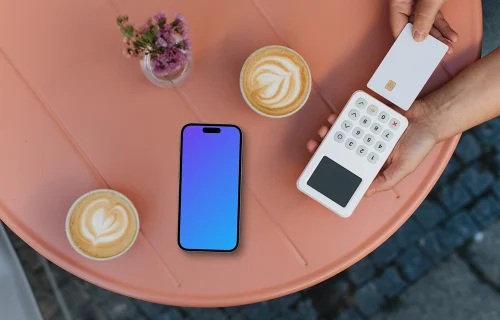 Coffee scene featuring payment terminal and an iPhone mockup