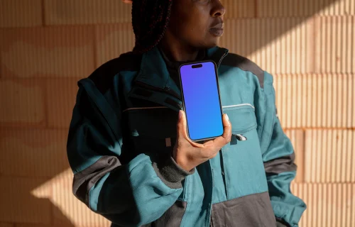 Construction worker presenting an iPhone mockup