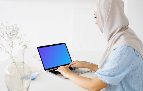 Female user typing on a Laptop mockup