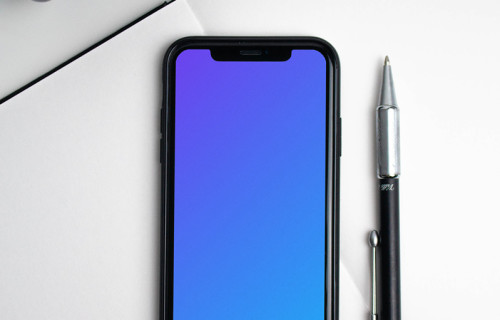 iPhone mockup on a white notebook