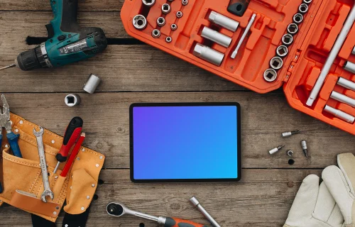 Tablet mockup surrounded by workshop tools