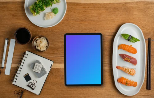 Tablet mockup with sushi on wooden table
