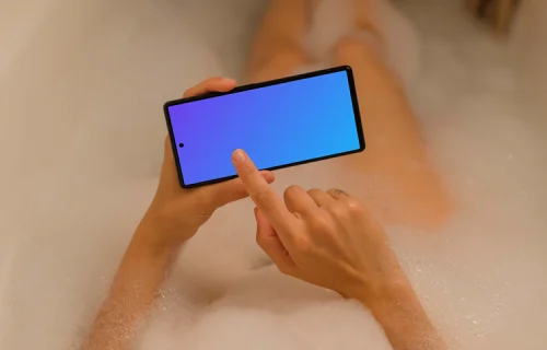 Woman in bath typing on a Google Pixel 6 mockup