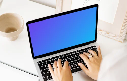 Young lady typing on a MacBook Pro mockup