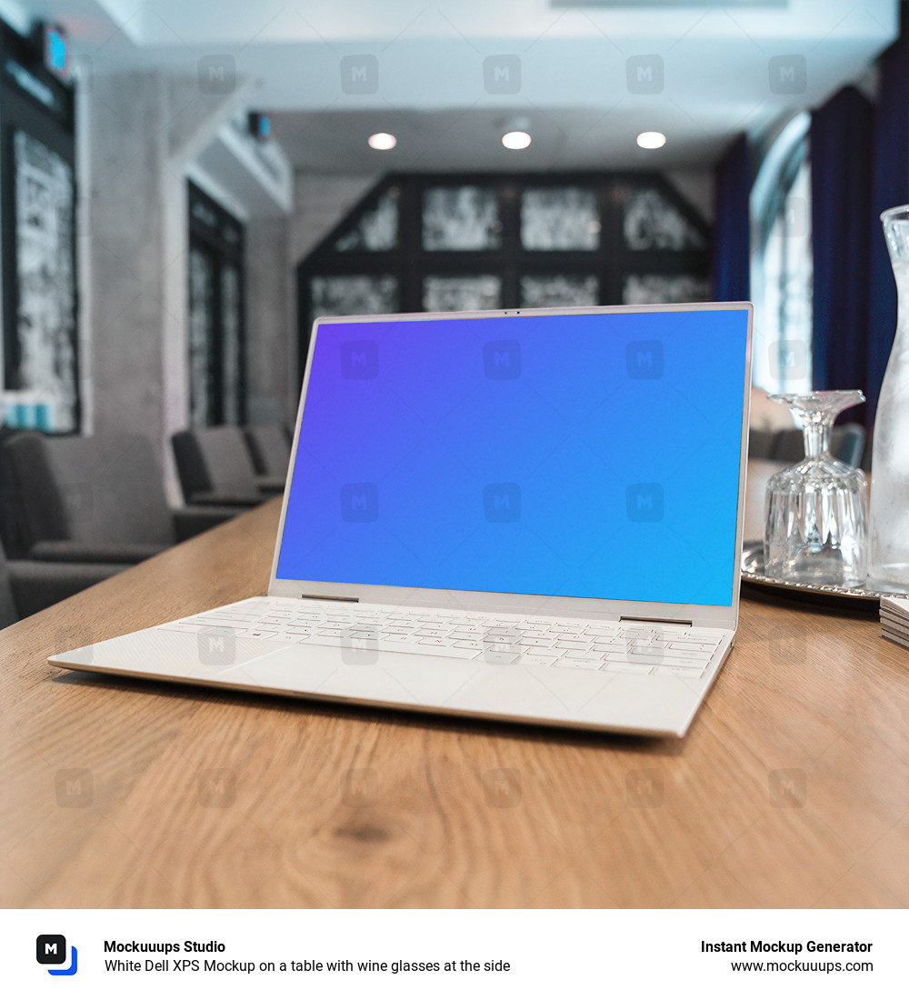 White Dell XPS Mockup on a table with wine glasses at the side
