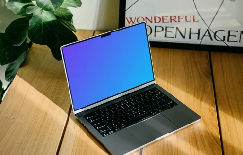 Laptop mockup with a plant in the background