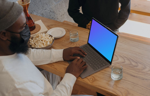 Microsoft Surface laptop mockup on a restaurant table