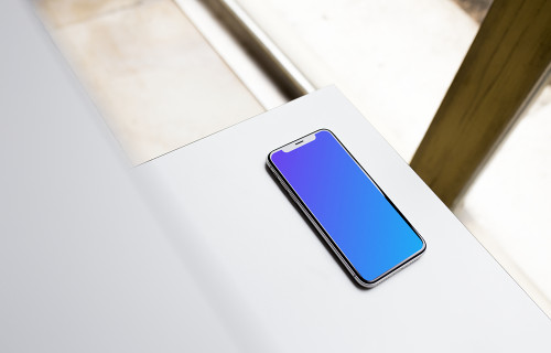 Angle view of iPhone X mockup on the table