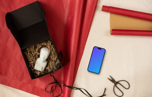 Christmas gift mockup with a phone on the side