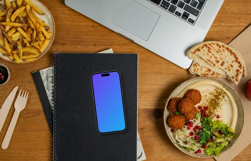 Falafel with hummus next to the Smartphone mockup