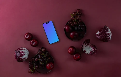 Food in Viva Magenta color shade next to the phone