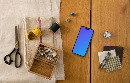 Smartphone mockup and natural fabrics on the wooden table