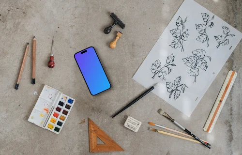 Smartphone mockup next to the painting accessories