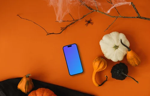 Top view of halloween background mockup with a phone