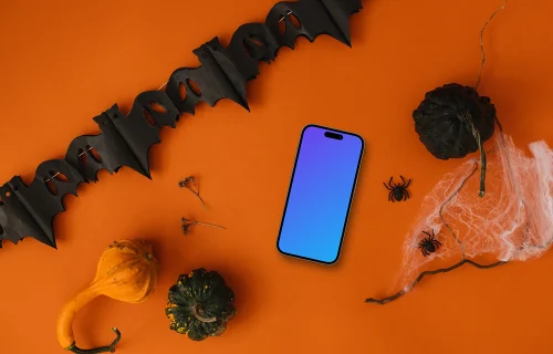 Top view phone mockup with halloween decorations