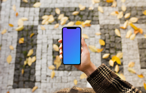 Woman standing with iPhone X mockup