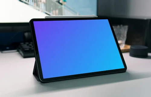 Angle view of tablet mockup on a work desk